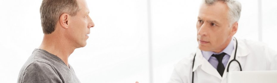 Man with urologist receiving prostatitis